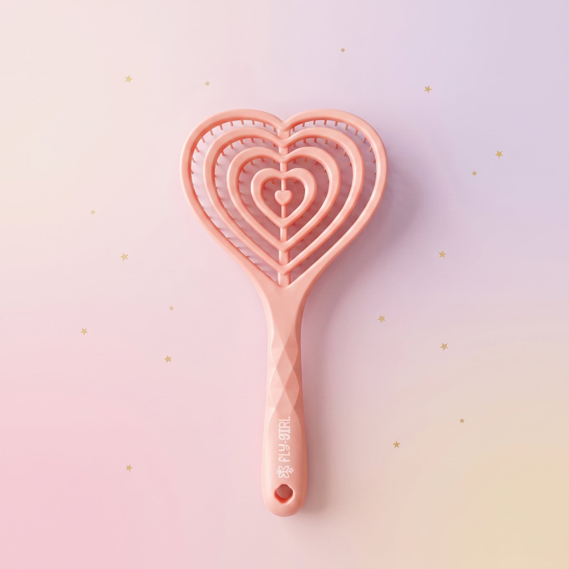 Pink heart-shaped cookie cutter on a gradient background