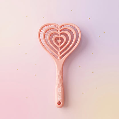 Pink heart-shaped cookie cutter on a gradient background