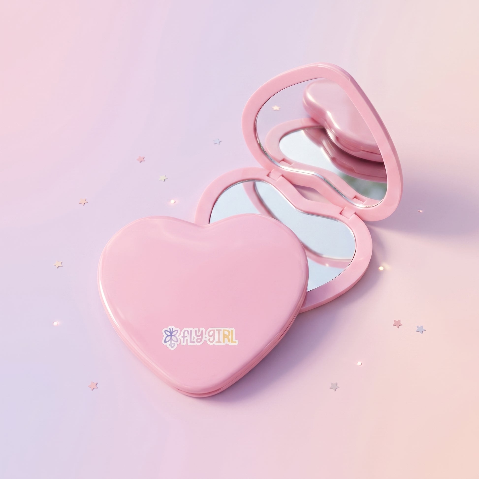 Heart-shaped pink compact mirror on a light purple background