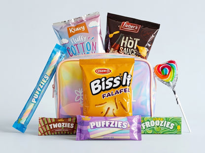 Assorted snacks including a bag of Bissli falafel, Twizzlers, and Puffzlies on a light gray background.