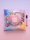 Decorative pillow with heart-shaped pillow and 'Camp Vibes Only' text on a colorful background