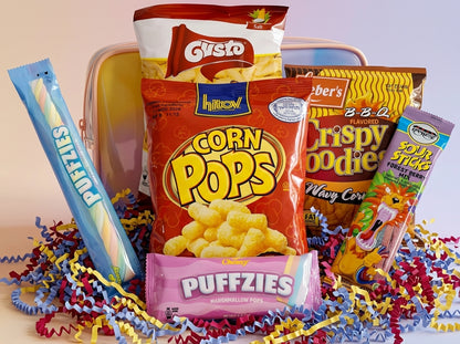 Assorted snack packages including Corn Pops and Puffzies on a colorful background