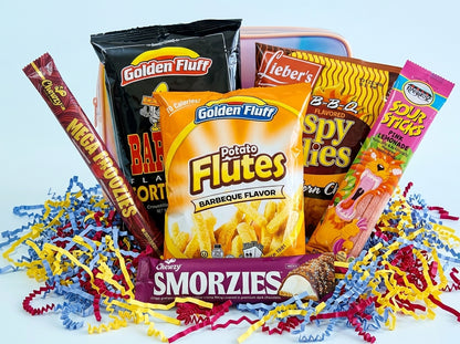 Assorted snack packages including Golden Fluff, Smorzies, and others with colorful shreds on a light blue background.