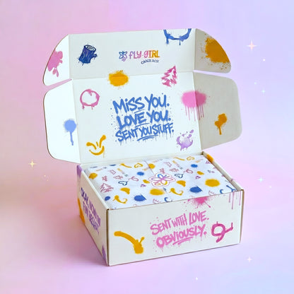 Colorful box with playful text and graphics on a pink background